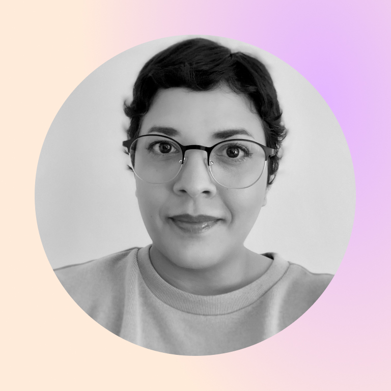 headshot of Prisma team member Camil Aponte with short hair and glasses