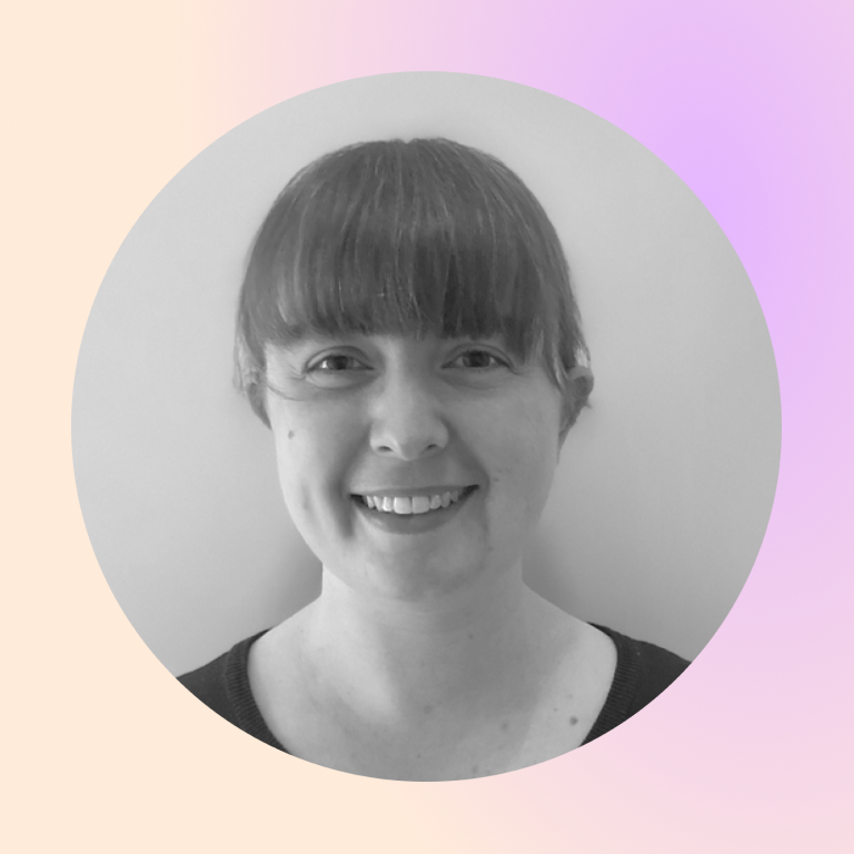 headshot of Prisma coach Emily smiling in black and white circular portrait