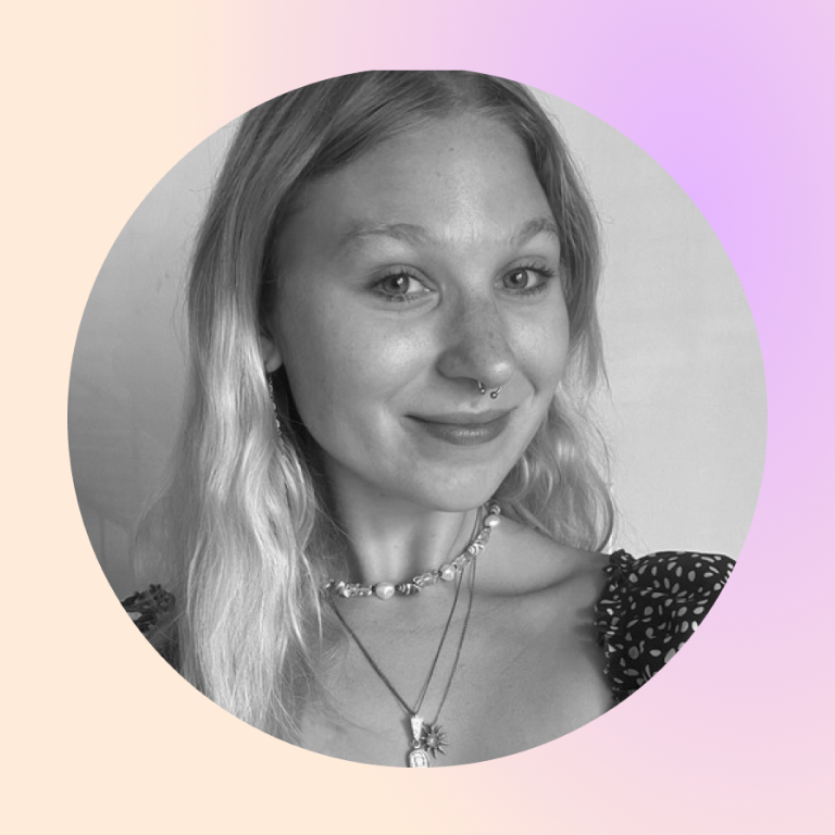 headshot of Prisma team member Tara Ventura smiling with layered necklaces