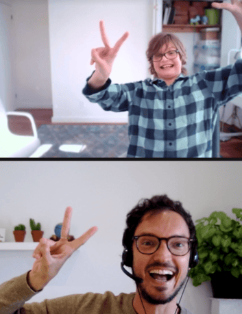 Prisma student and live teacher making excited hand gestures during a video call