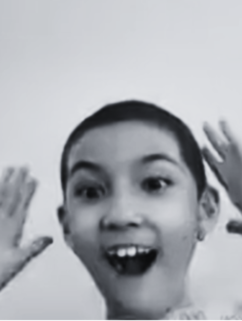 excited young Prisma middle school student with hands raised in surprise