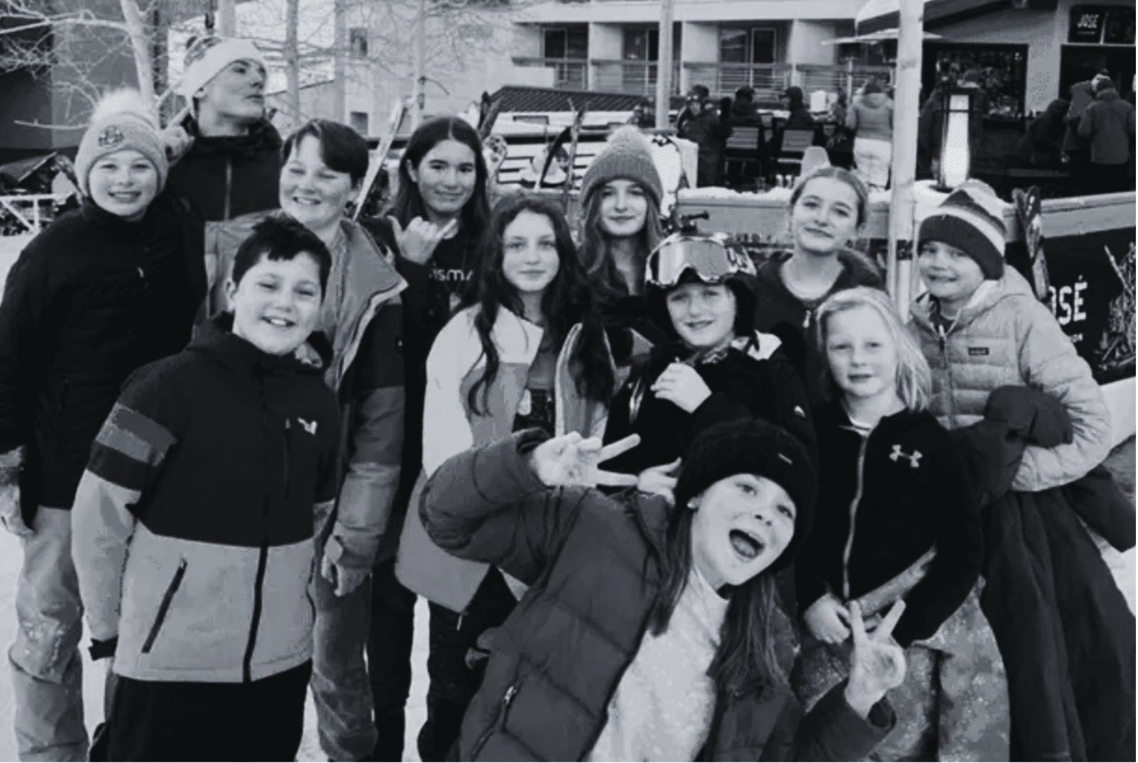 group of Prisma kids smiling together in winter gear at a ski retreat homeschool meetup