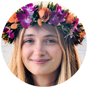 headshot of Prisma team member wearing a colorful tropical flower crown
