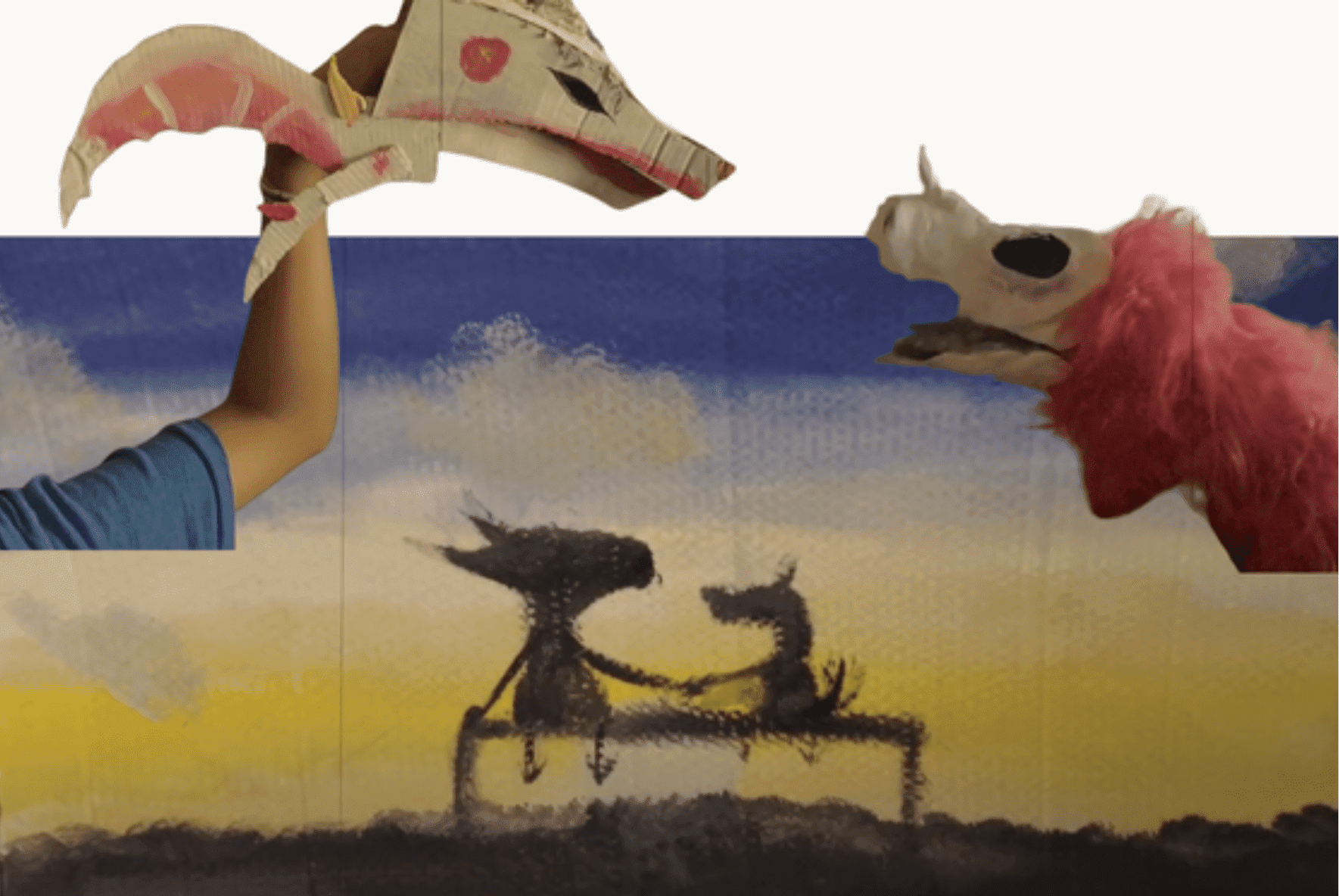 Prisma middle school student creative art collage with handmade puppets and painted backdrop