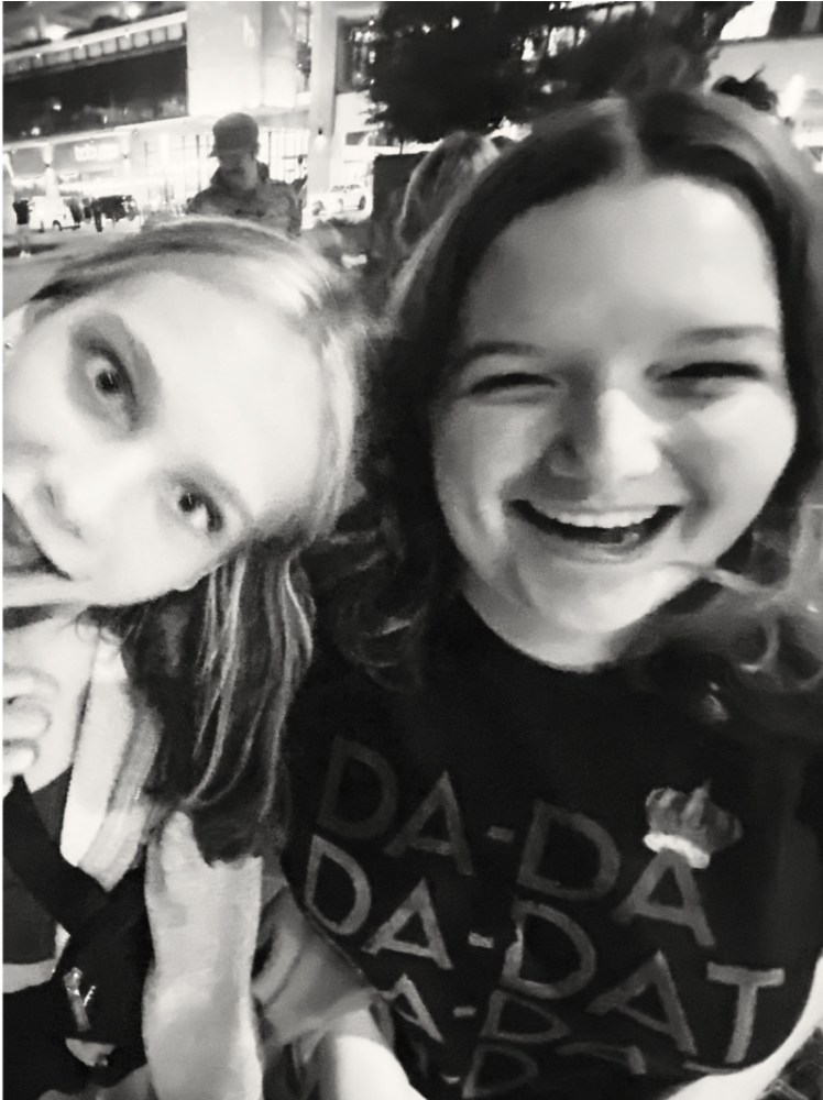 two Prisma students laughing together in a black and white selfie outdoors