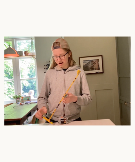 Prisma learner demonstrating a hands-on project at home