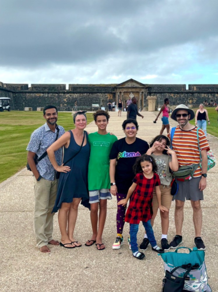 Prisma families posing together at a historic fort during a community meetup