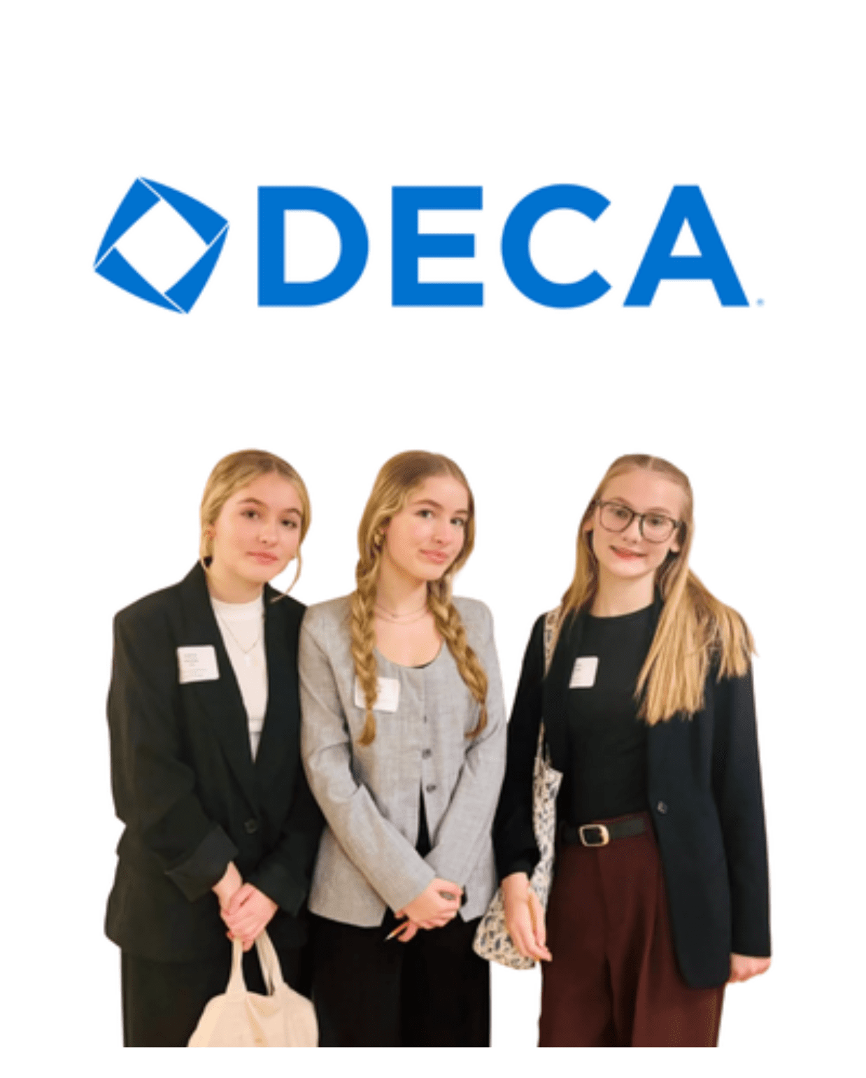 three Prisma high school students in professional attire posing under the DECA logo