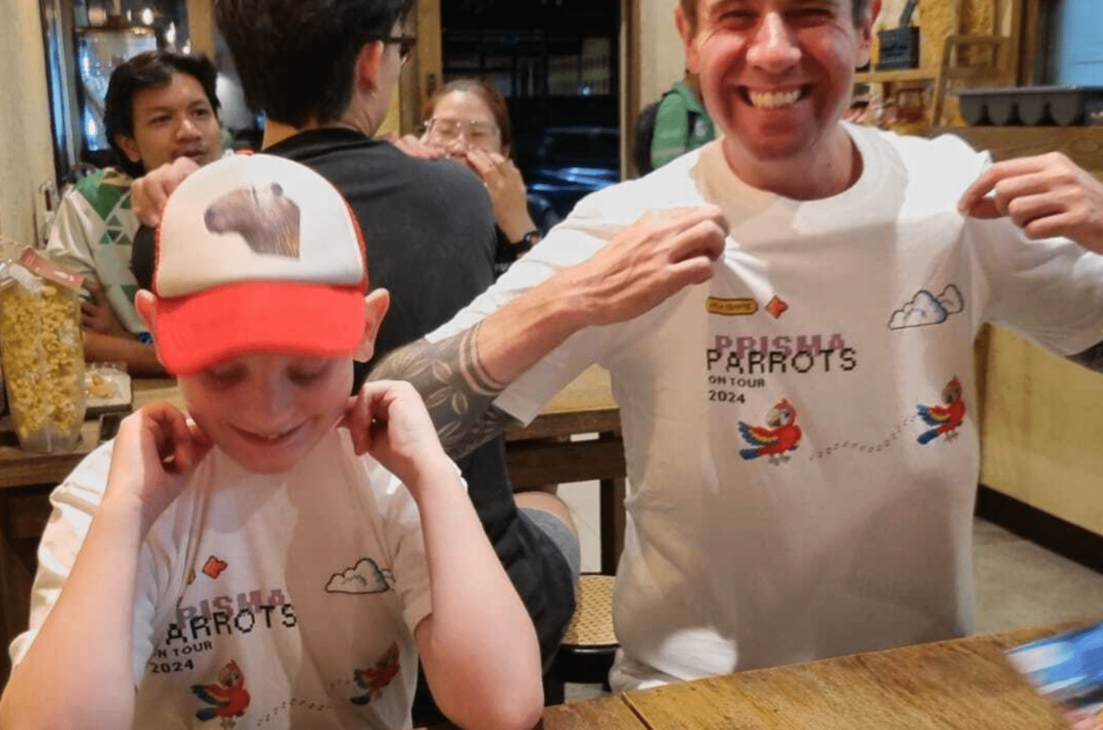 Prisma Parrots family meetup with parent and child wearing matching team t-shirts