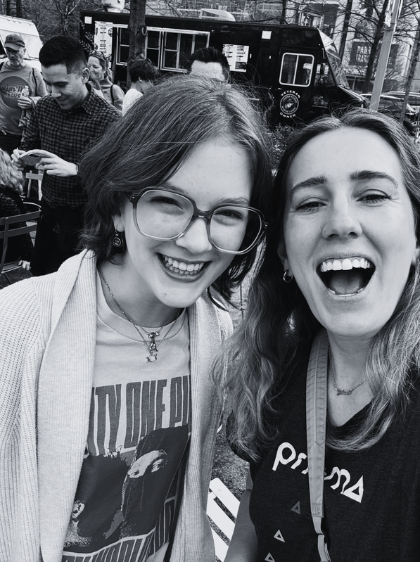 two Prisma coaches smiling together in a black and white selfie