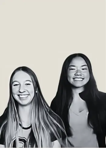 two smiling Prisma high school learners in black-and-white cutout style